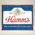 Jones Peak Hamm's Sky Blue Waters metal sign with distressed blue border and white center featuring red Hamm's logo and vintage text.