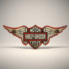 Jones Peak Harley-Davidson winged cast iron wall plaque with red and white detailing, antique patina finish.