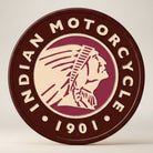 Jones Peak Indian Motorcycle 1901 round metal sign with Native American profile in maroon and cream.