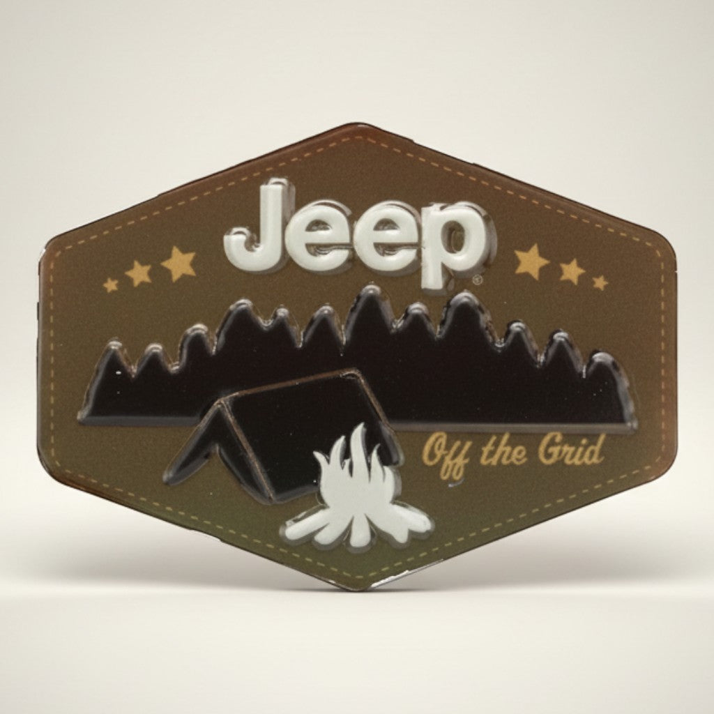 Jones Peak Jeep camping embossed metal magnet with tent, campfire, and mountains. Features "Jeep Off the Grid" text.