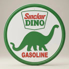 Jones Peak Round Sinclair Dino Gasoline metal sign with green dinosaur and red lettering.
