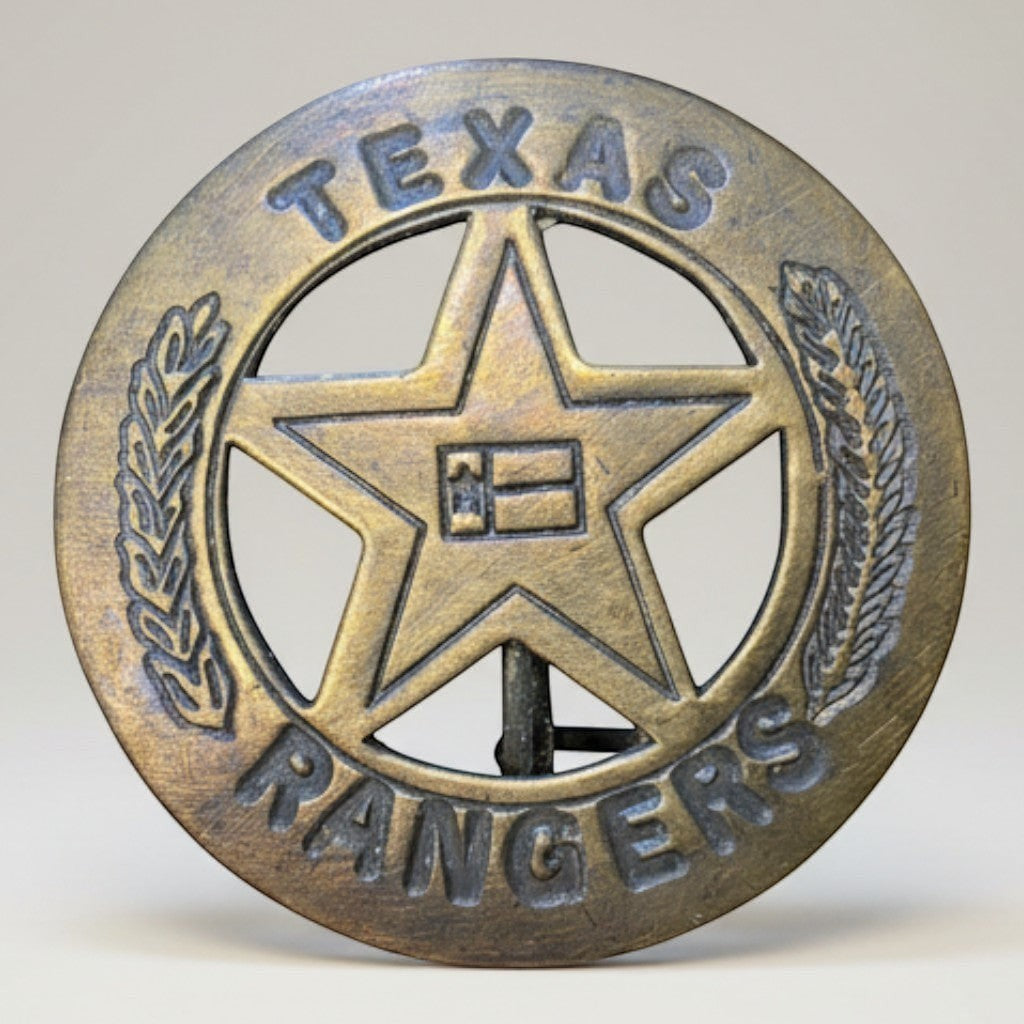 Jones Peak solid brass Texas Ranger badge with antique finish, star, and laurel wreath detail. Decorative reproduction.