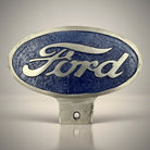 Jones Peak vintage Ford aluminum license plate topper with blue textured background and silver lettering.