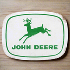 John Deere logo rustic metal magnet featuring a classic design, measuring 3" x 2.25" by Open Roads.