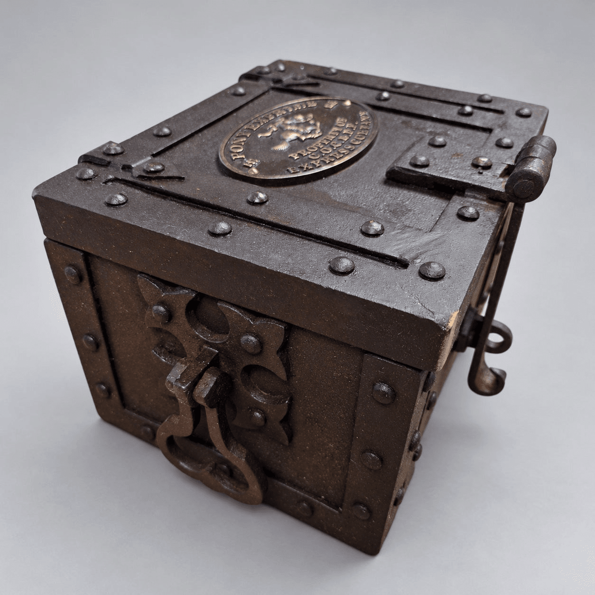 Pony Express cast iron strong box, current design, angled view 2 on a soft gray background