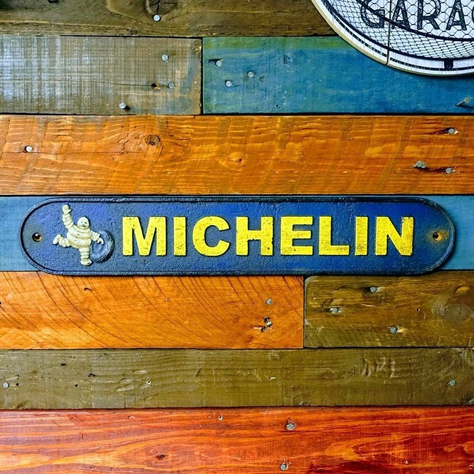Tire Man Cast Iron Plaque With A Distressed Antique Hand Painted Finish (19.5" x 3.5") - Jones Peak
