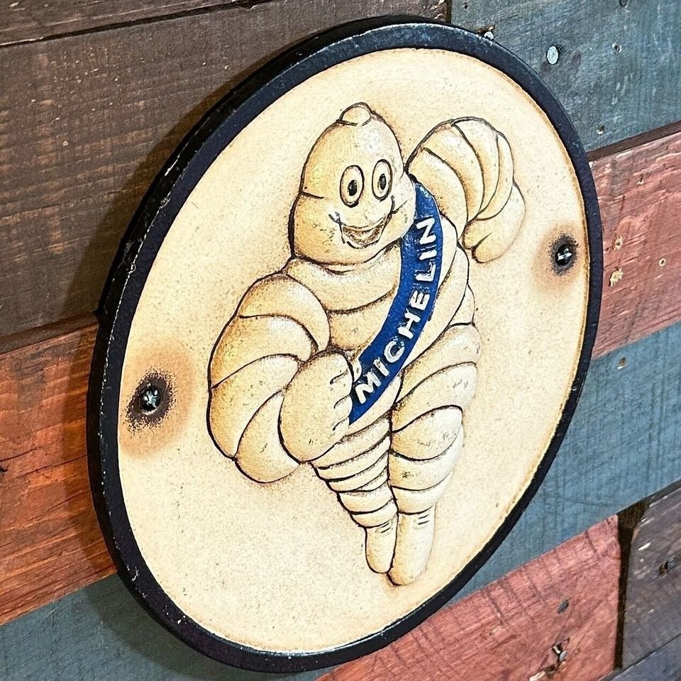 Tire Man Cast Iron Plaque With Painted Antique Finish (9.5 Round) - Jones Peak